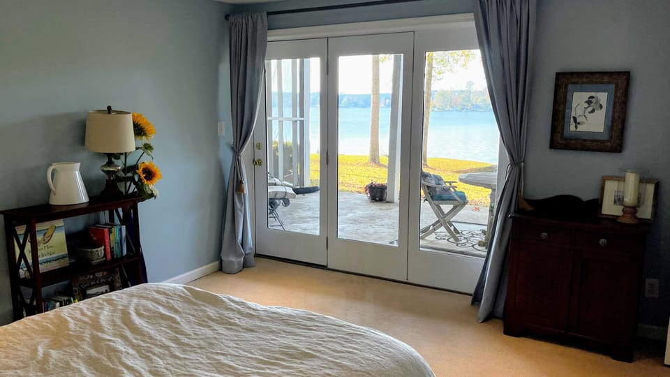 Bedroom has lake view and private patio TV