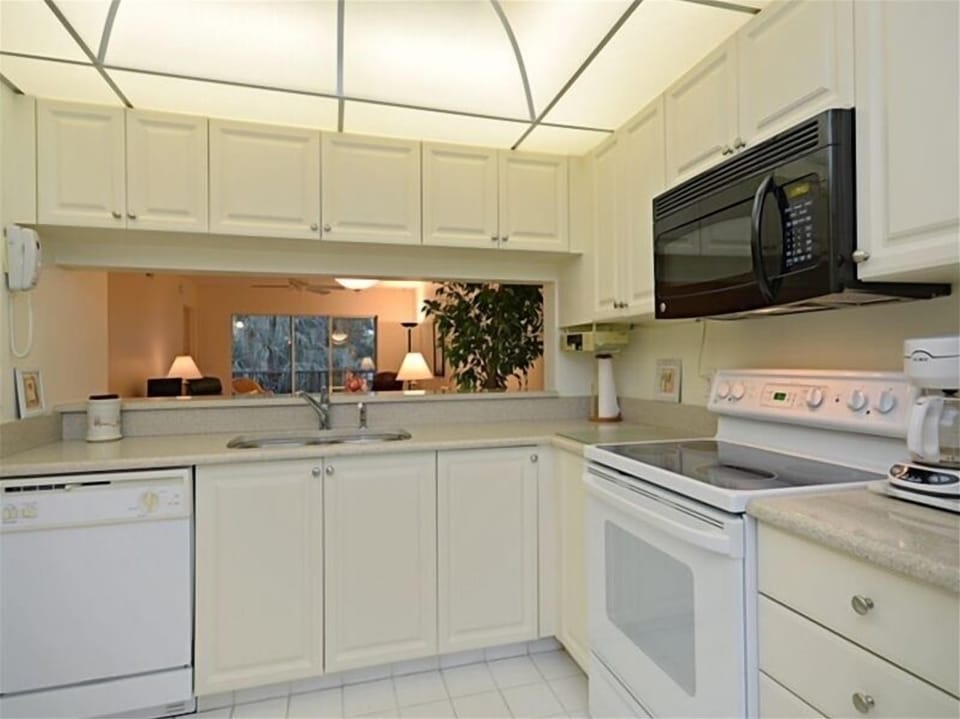 Eat in kitchen with bar counter to dining/ living area.