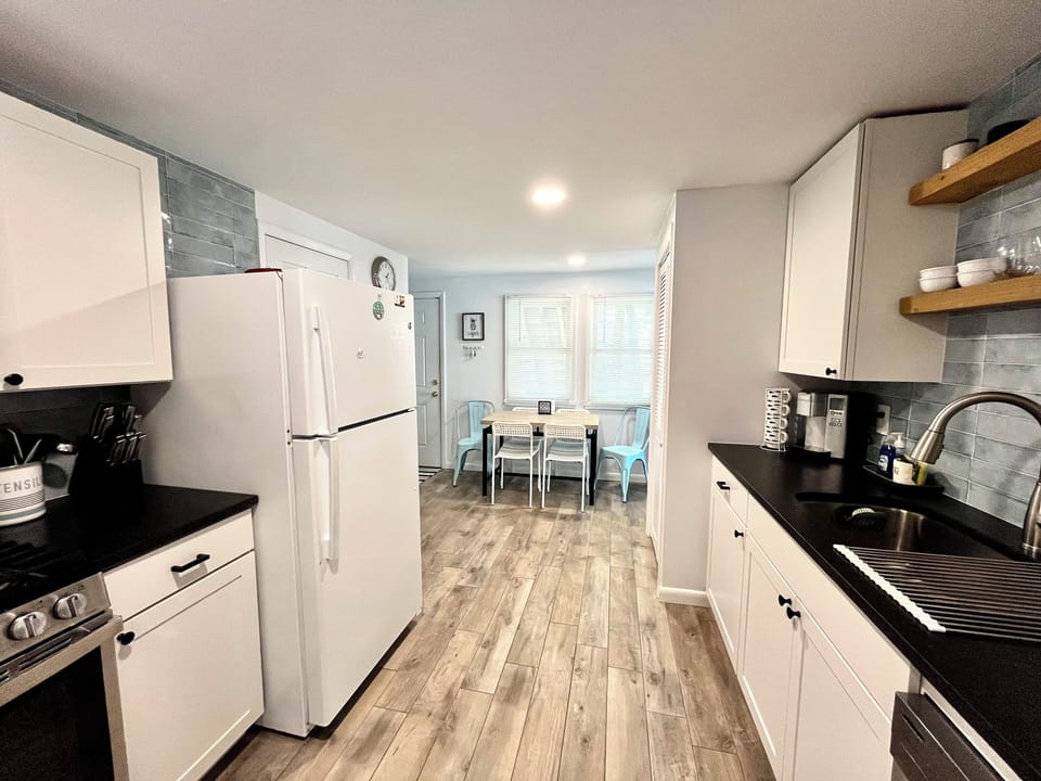 Full kitchen with fridge, gas stove, microwave, and dishwasher