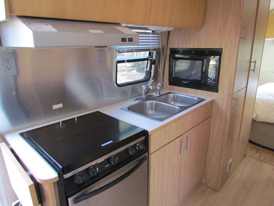 Full kitchen; stove, sink, microwave, plenty of storage.