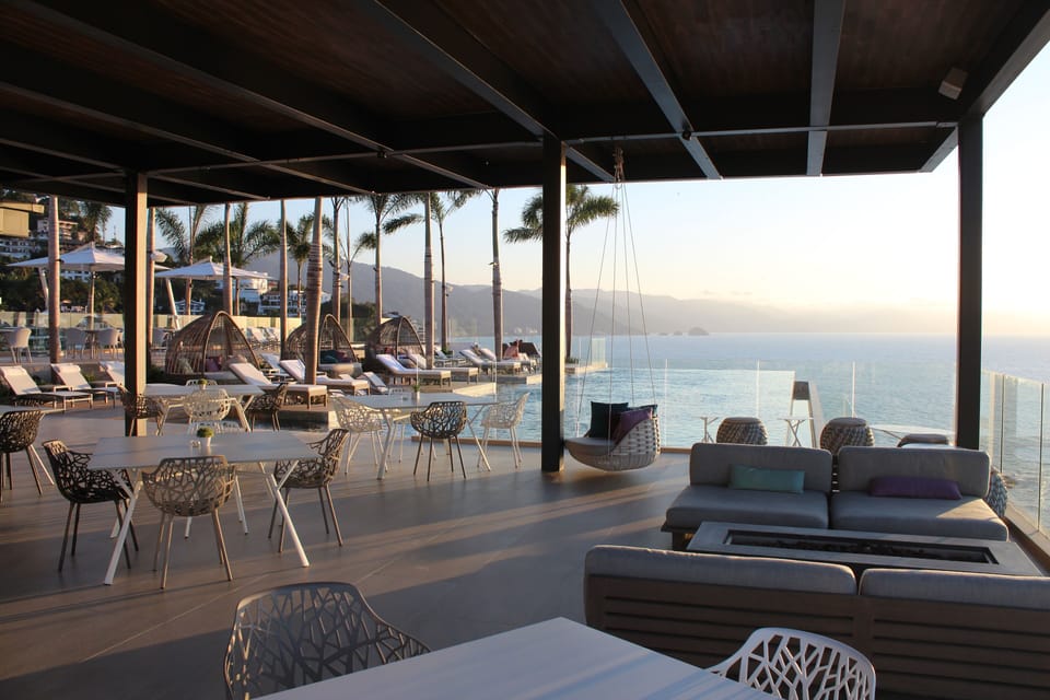Rooftop pool & bar with fire pit for great conversations with friends.