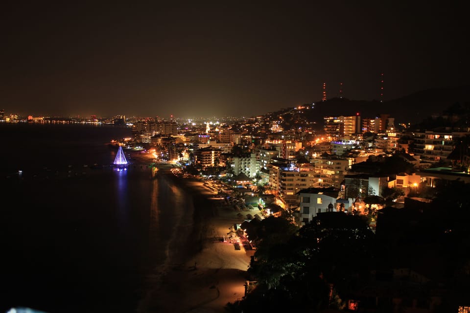 View of Old Town at night from Sayan Beach rooftop