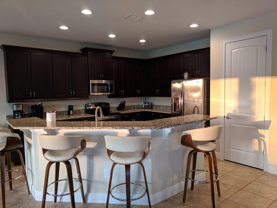 Kitchen with Breakfast Bar with the beautiful morning sun!