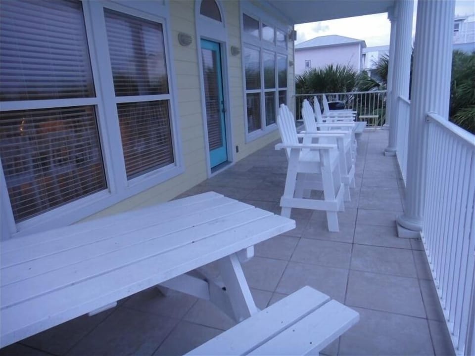 Large 37'x10' balcony with chairs, two picnic tables and BBQ grill