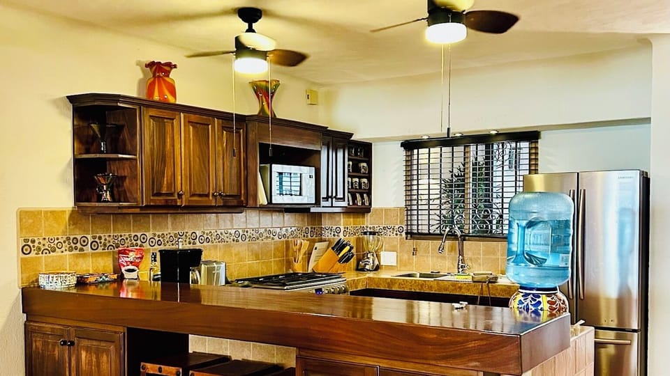The kitchen features a bar area that's great for serving snacks and appetizers