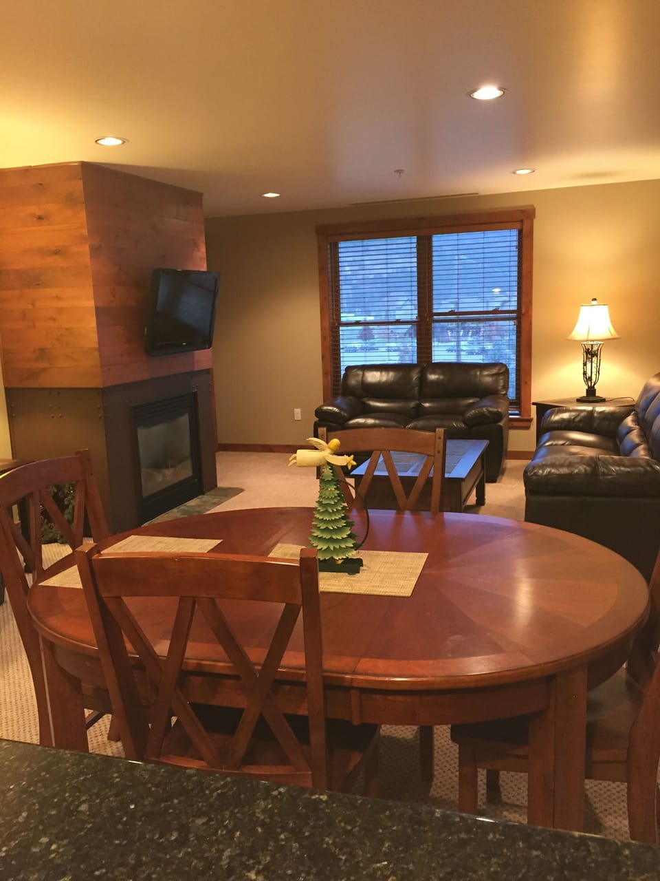 View from kitchen overlooking dining area and living room. 