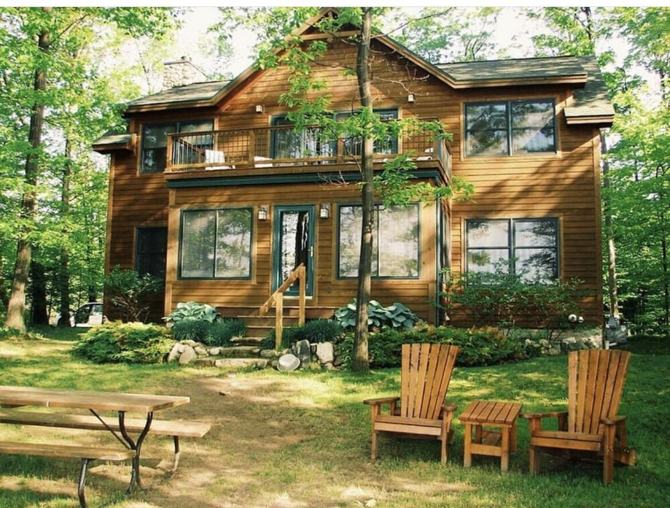 Lakeside view; upper porch provides tranquil space with bird's eye view of lake