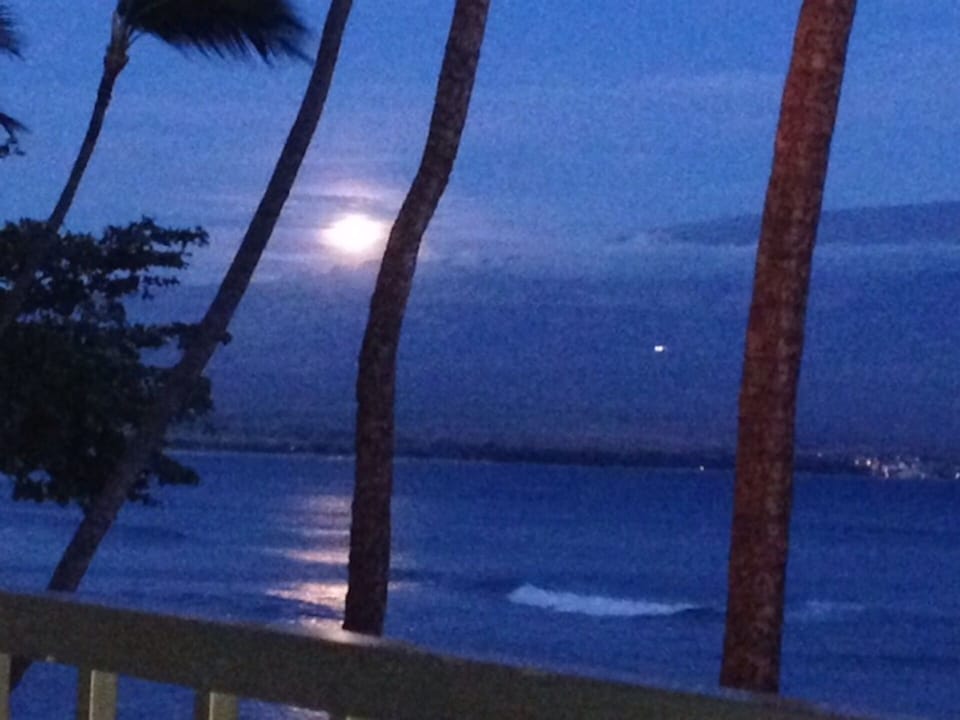 A dramatic moonrise over Haleakala from our condo lanai