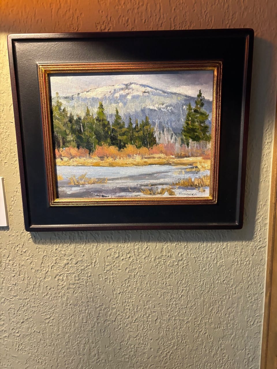 Original oil paintings and photographs add to richness of decor.