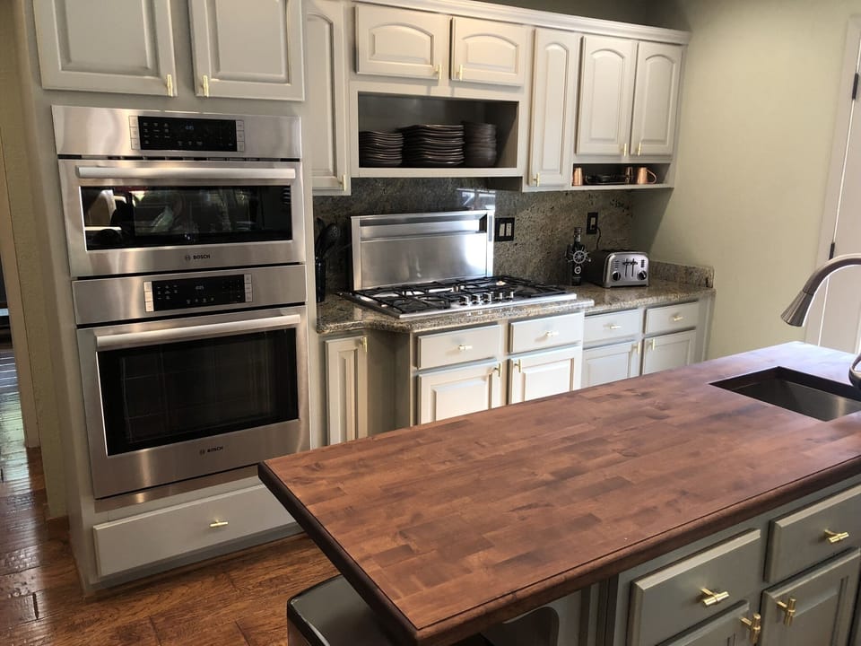Island w/ prep sink; microwave, convection and standard ovens;  Thermador range.