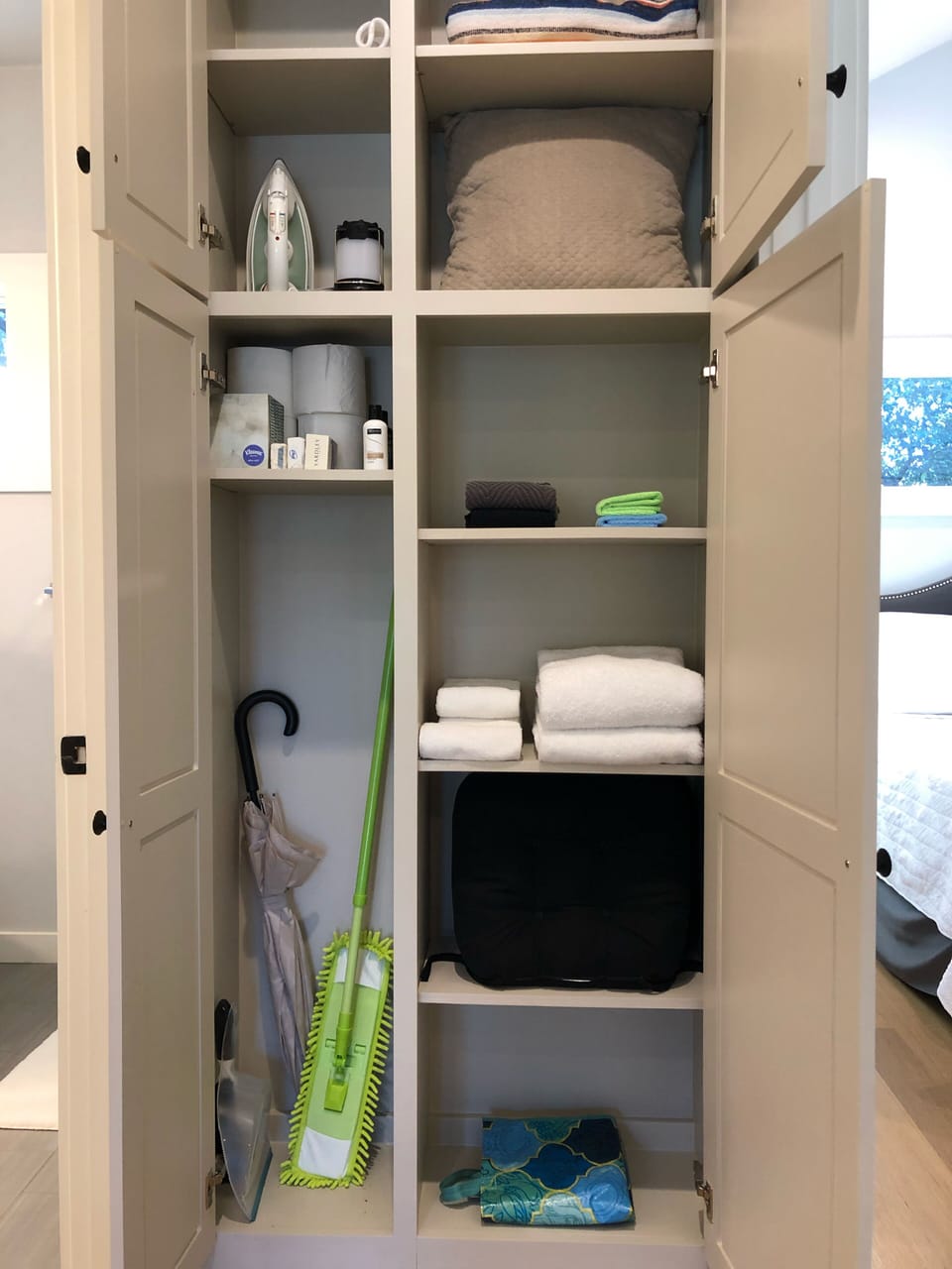Hallway cabinet contains extra supplies and basic necessities.