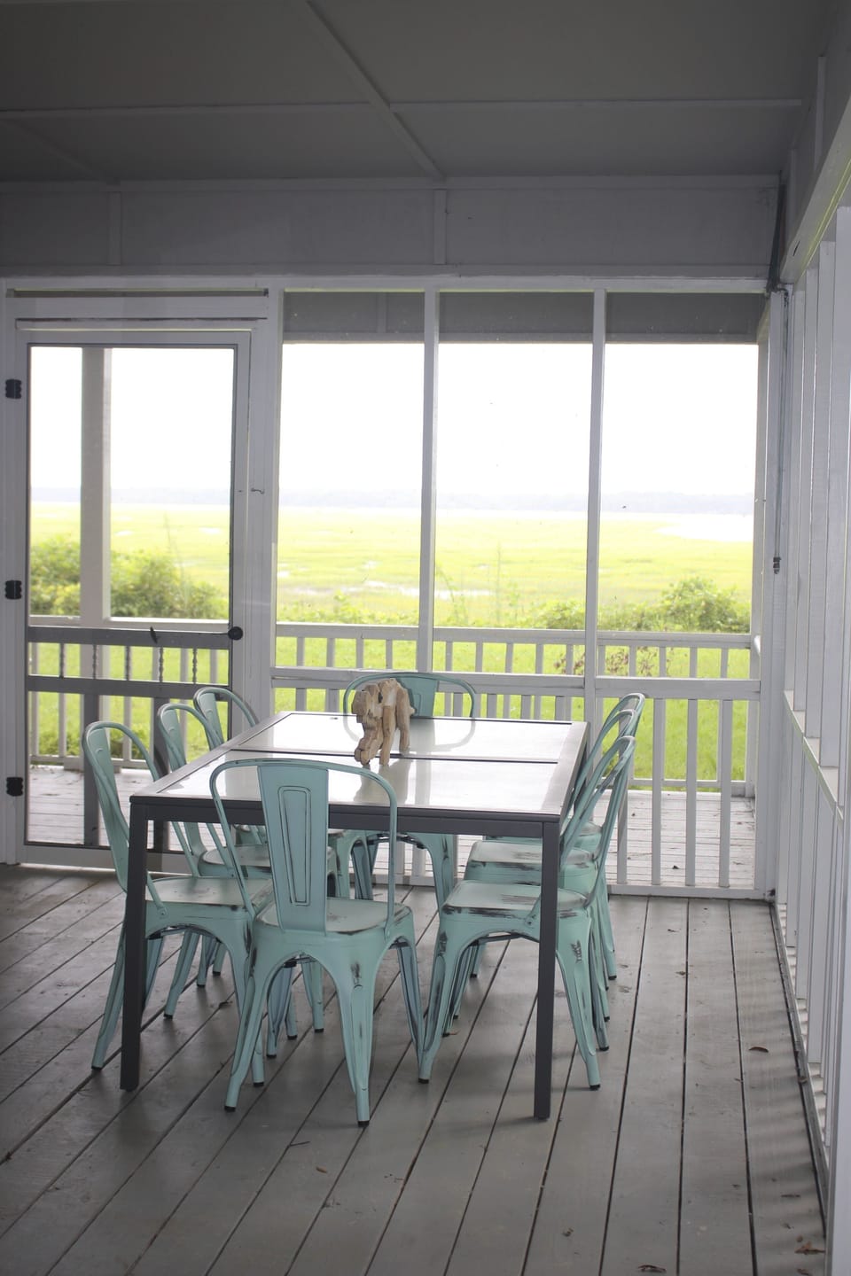 Screened in porch with dining table