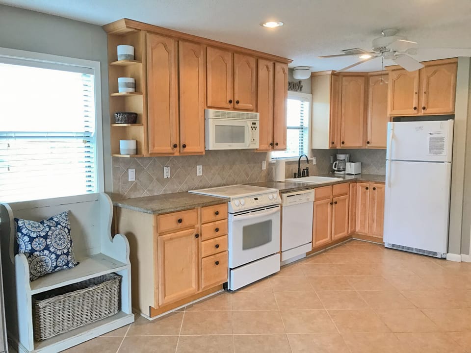 New tile floors, granite countertops, washer and dryer just off kitchen. 