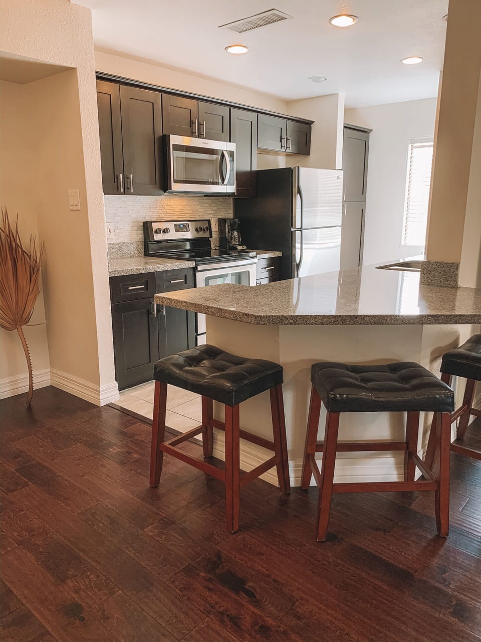 Stainless Steel Appliances + Granite Countertops + Breakfast Bar