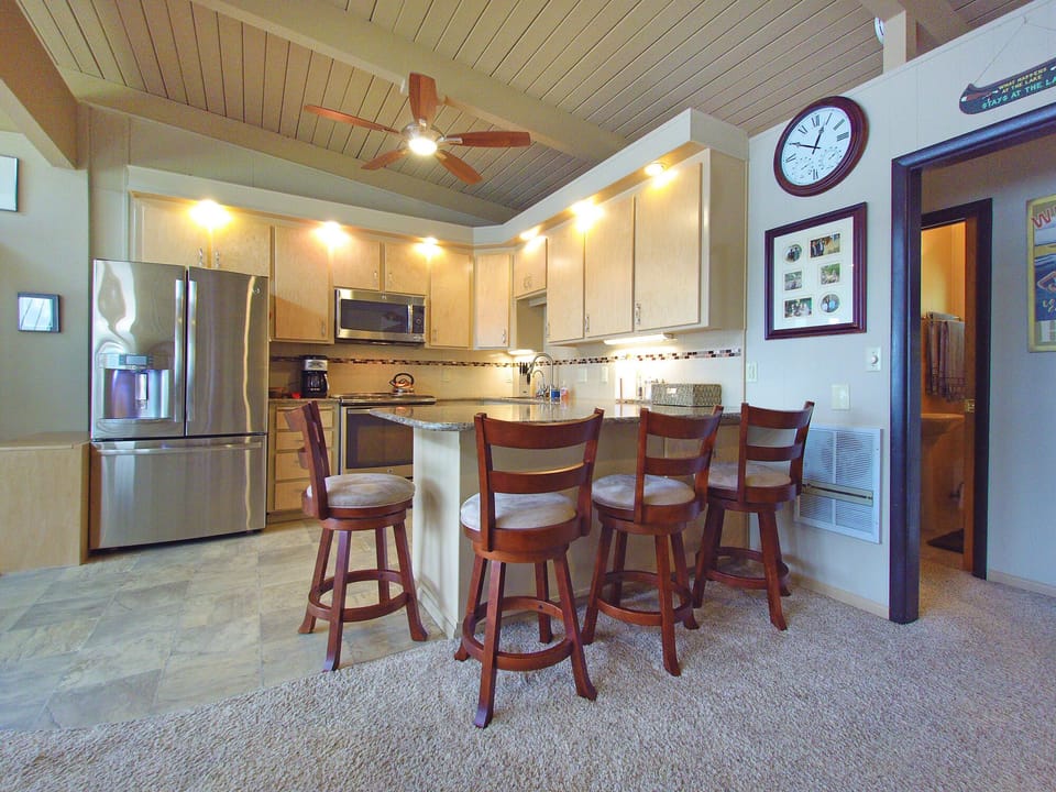 Fully equipped kitchen with plenty of seating.