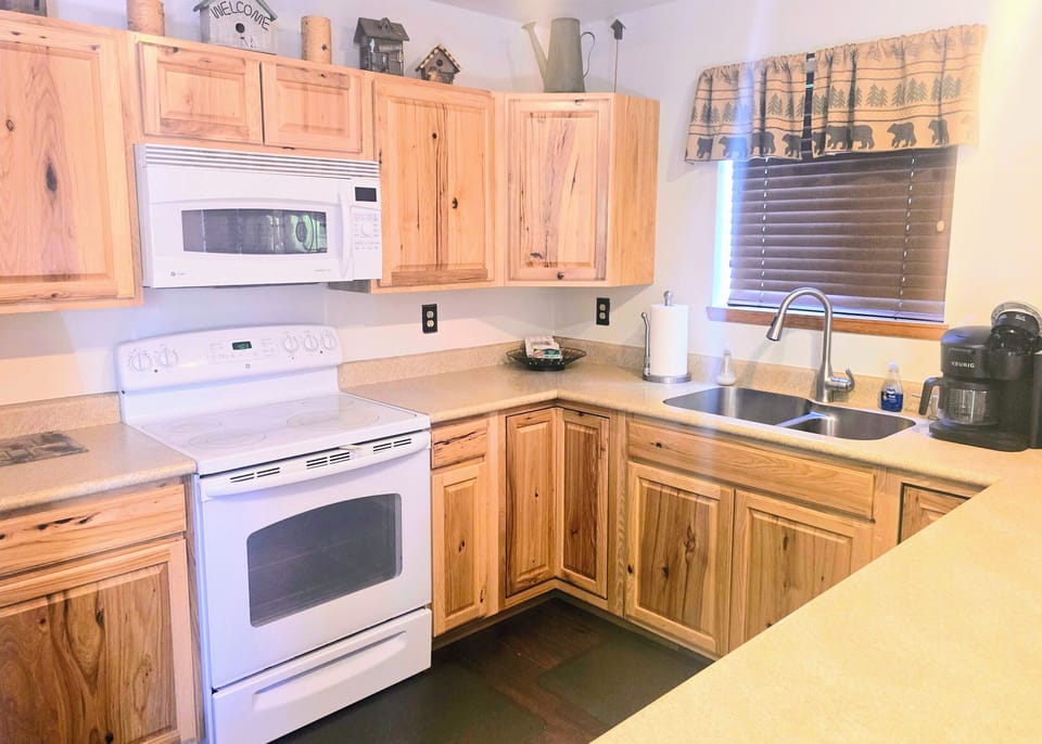microwave, coffee maker,  stovetop, DW, oven, full-size refrigerator 
