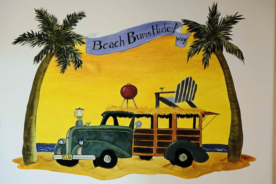 Local artist painted the mural on murphy bed wall in the studio downstairs.