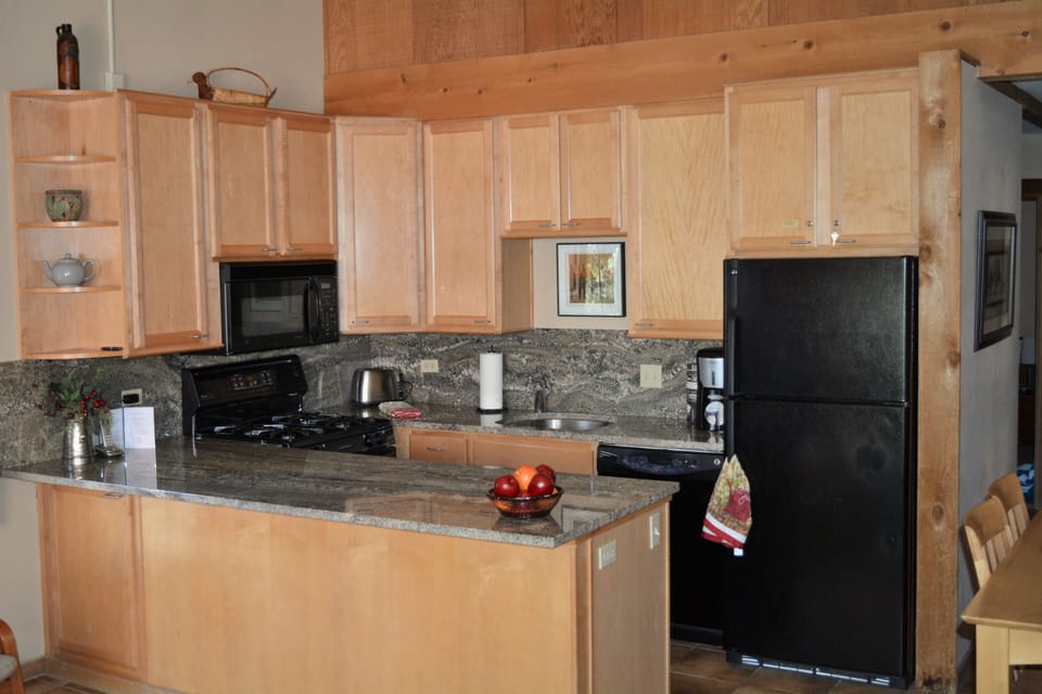 Remodeled kitchen with granite counters and all the cooking comforts of home.