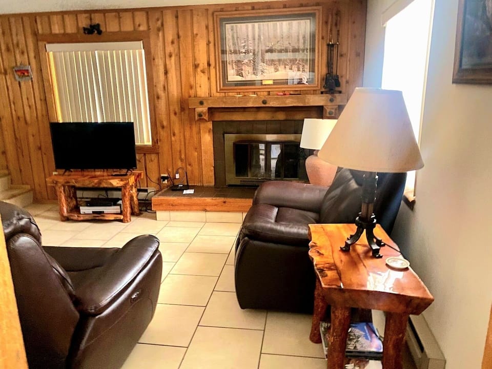 Get cozy in the living room with a wood burning fireplace.