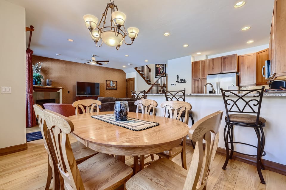 Dining room table seats 8.  Living room in the background, kitchen on the right