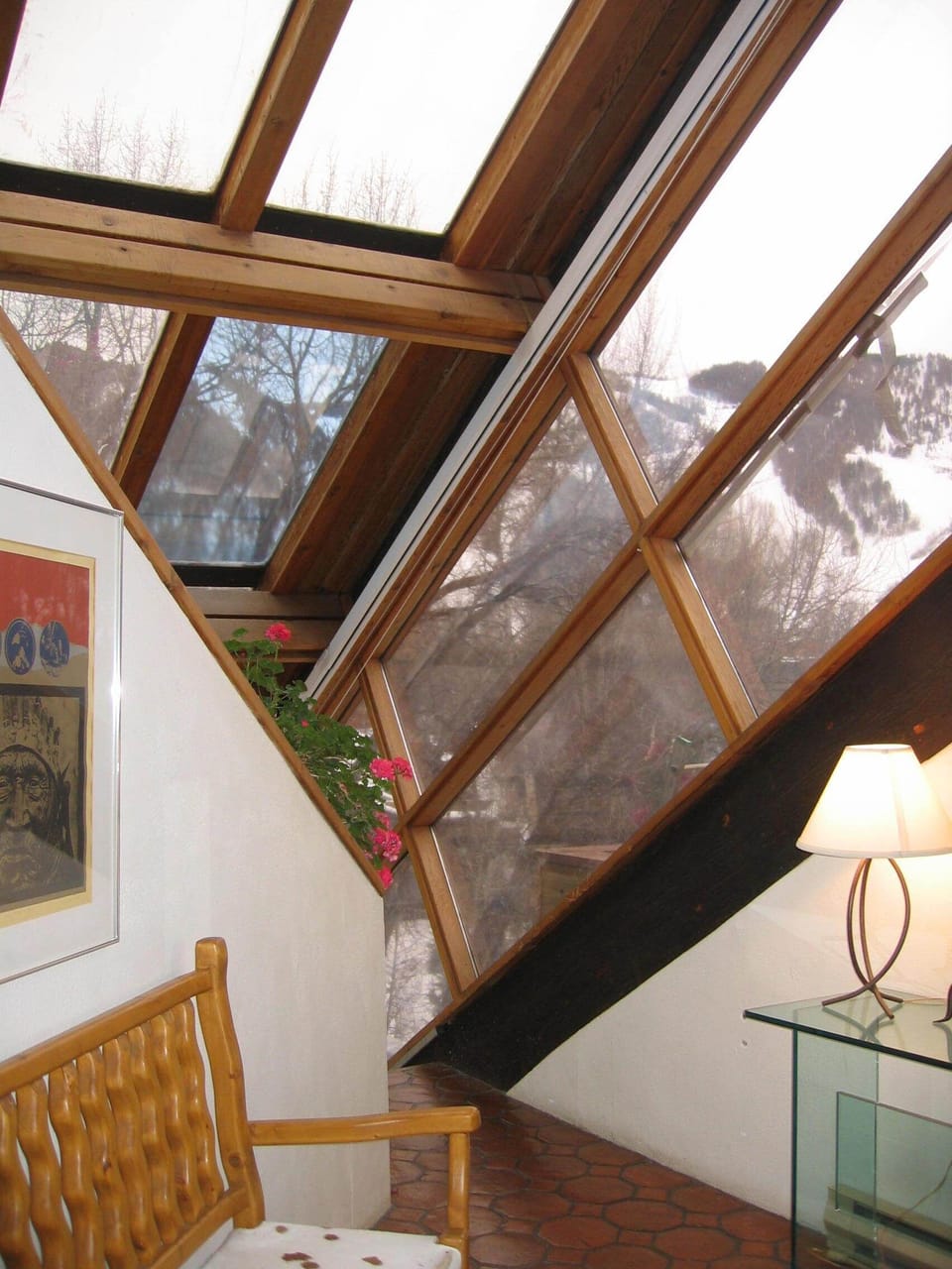 Entry area showcases wall of windows that enhance the mountain views.