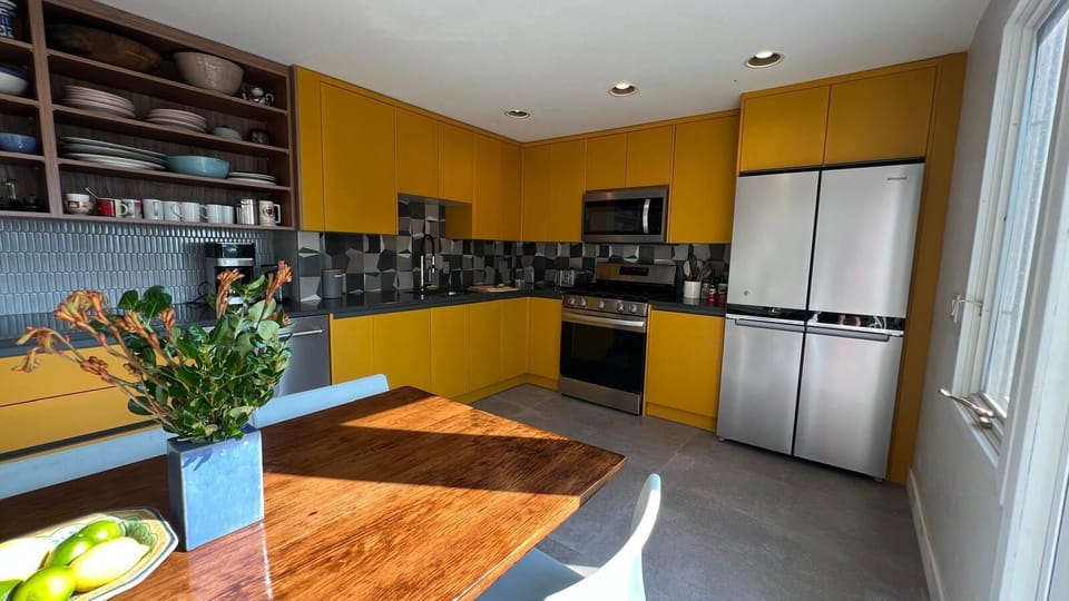 kitchen w/ modern amenities and lovely tile floors--underfloor heating in winter