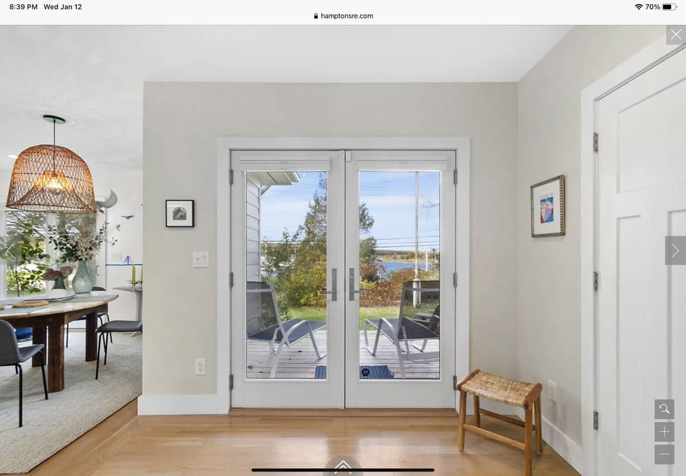 Front doors with water view of marina across the street