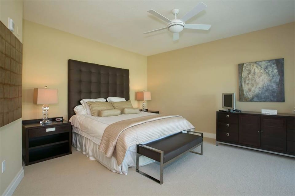Master bedroom with king bed and television