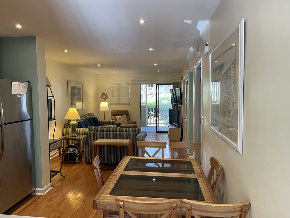 Open Living/Dining area with view to Lagoon/pool