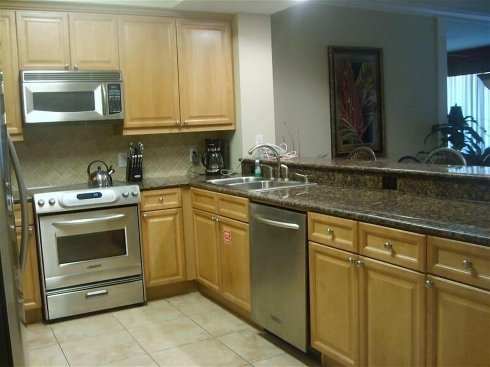 Granite Countertops, Breakfast Bar, and Upgraded Tile Flooring.