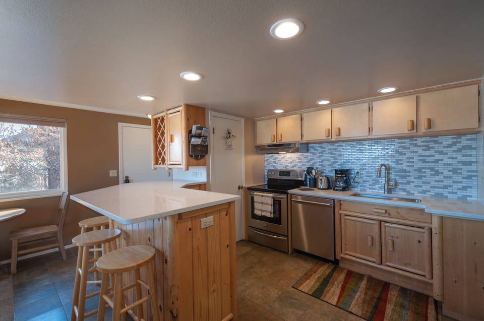 Newly refurbished kitchen, with quiet Bosch dishwasher, quartz countertops.