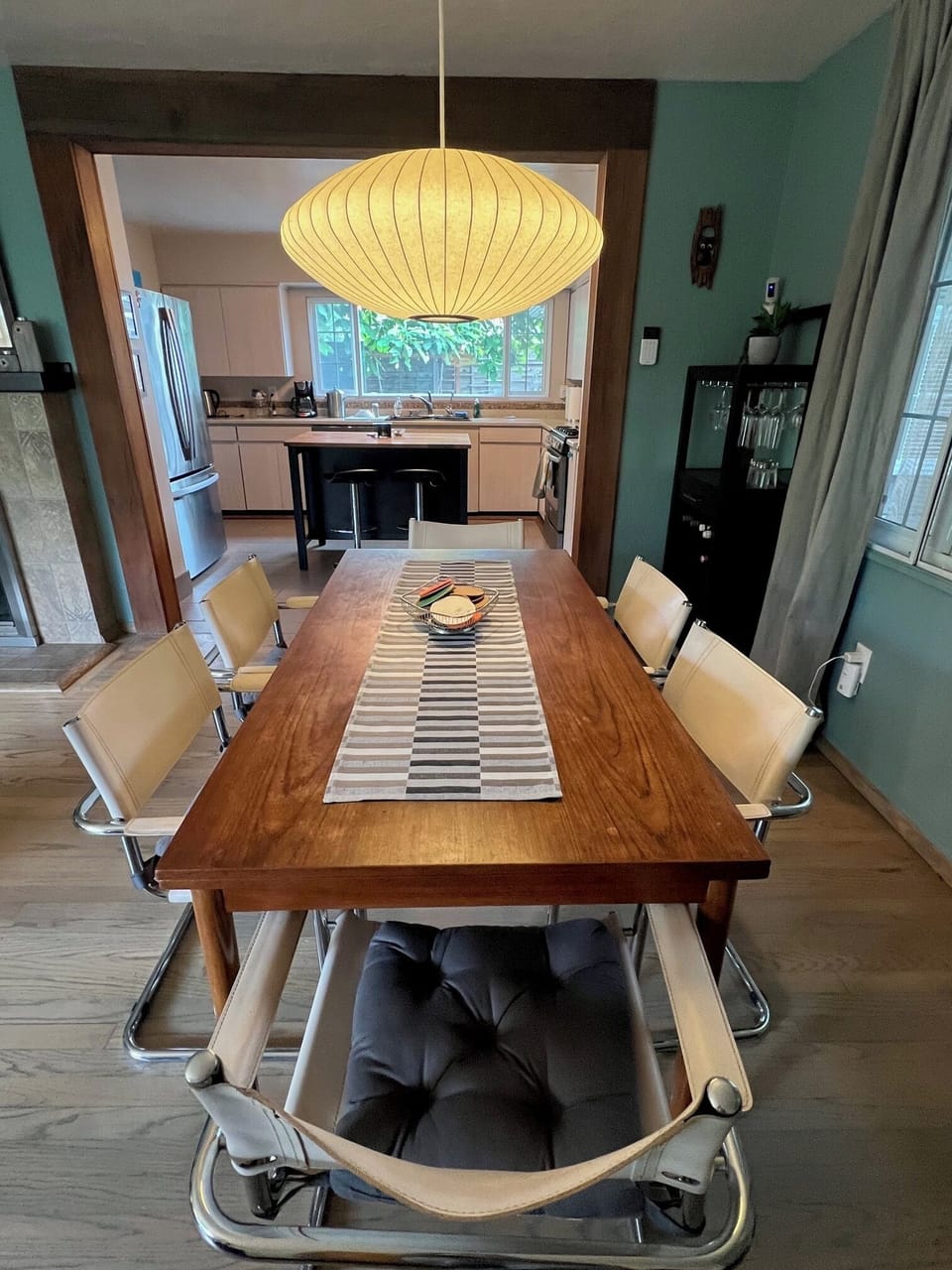 Danish modern dining table for 6. George Nelson vintage light above.