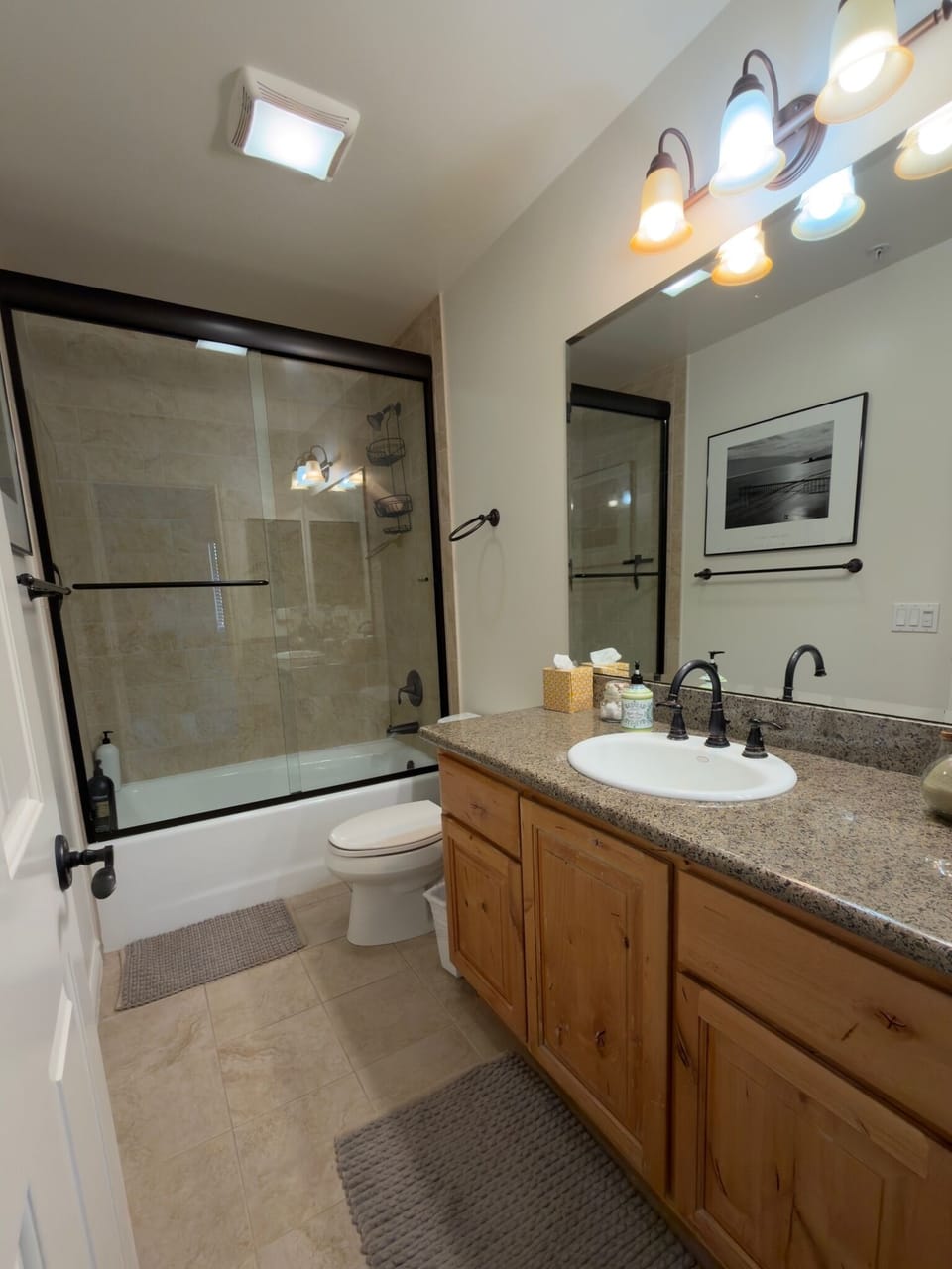 Bright & spotless bathroom, located next to east bedroom upstairs.