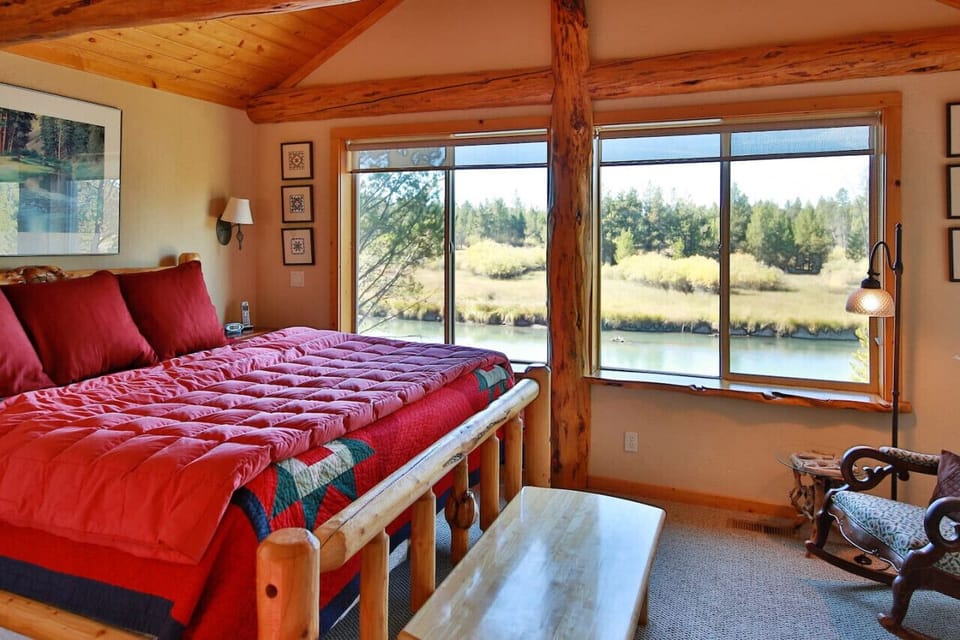 Primary bedroom with king and river views