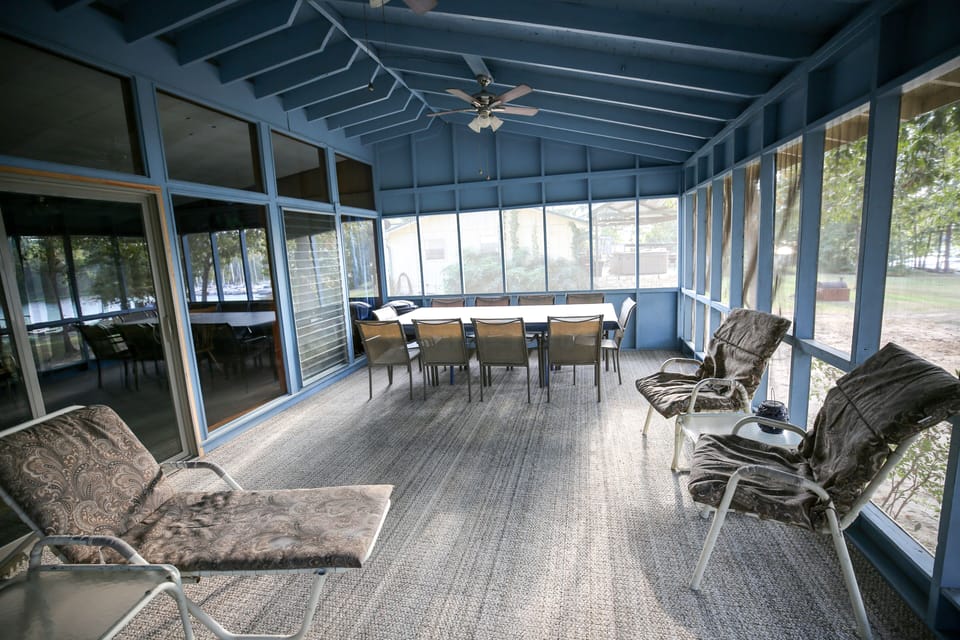 Spacious enclosed porch area adjoining kitchen/dining and overlooking lakefront 