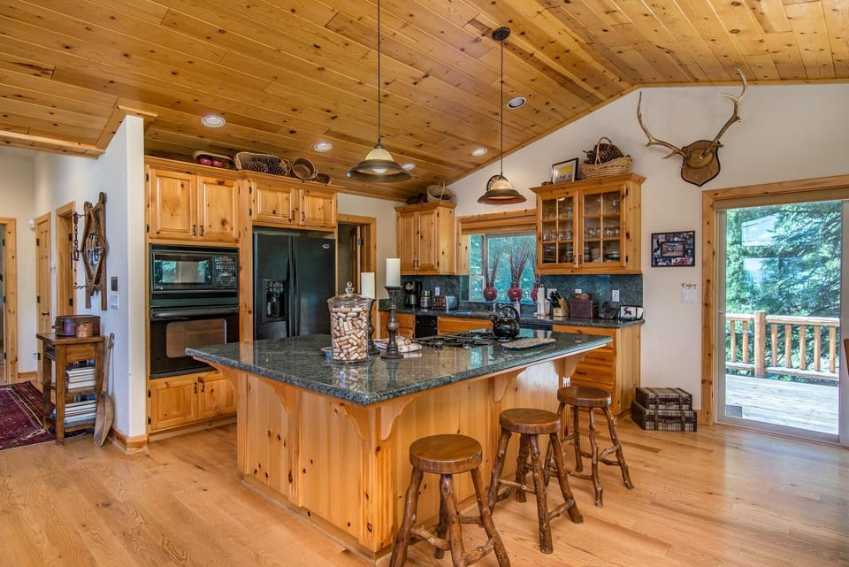 Kitchen adjoining Great Room, & Rear Deck. This Floor also has a 1/2 bath