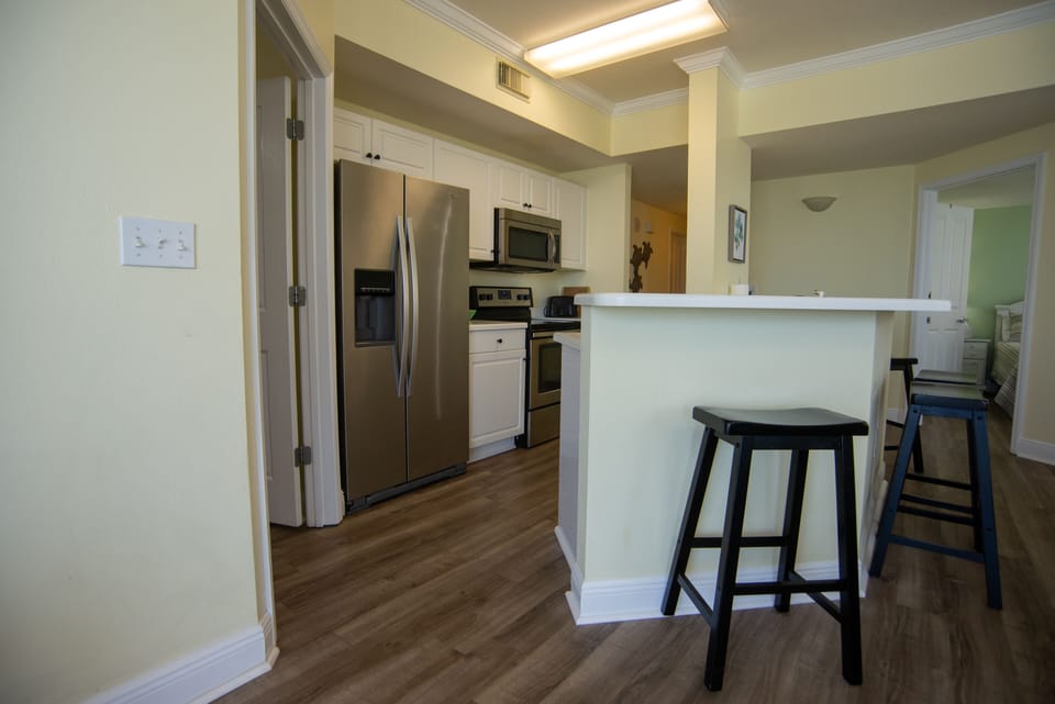 View of kitchen and extended counter for 6 bar stools