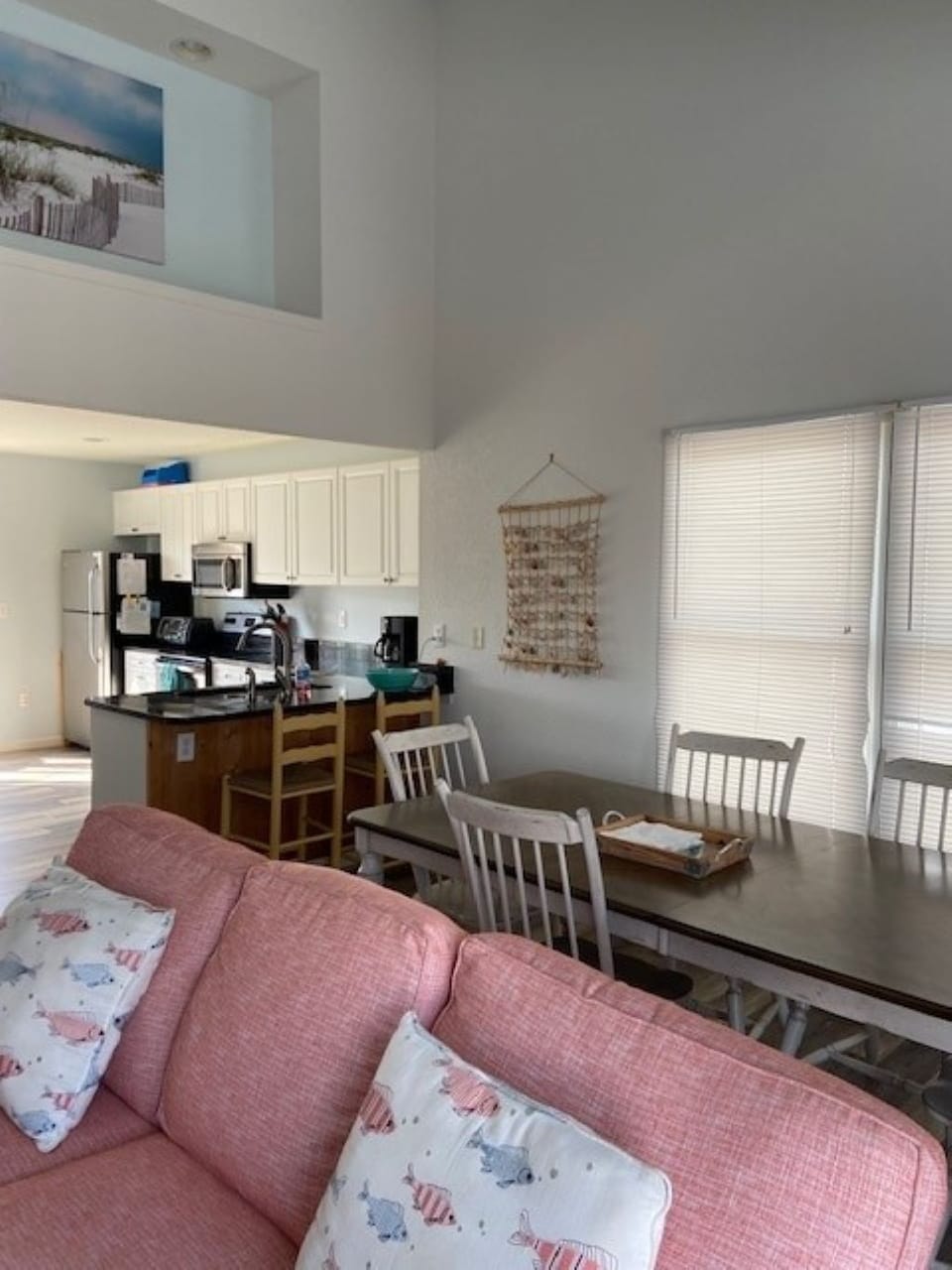 View of large table (6-8 persons) and kitchen bar the kids will love to occupy.