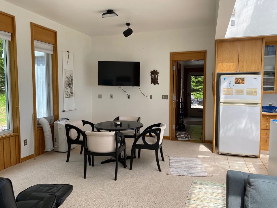 Game table and stand alone air conditioner by the garden window