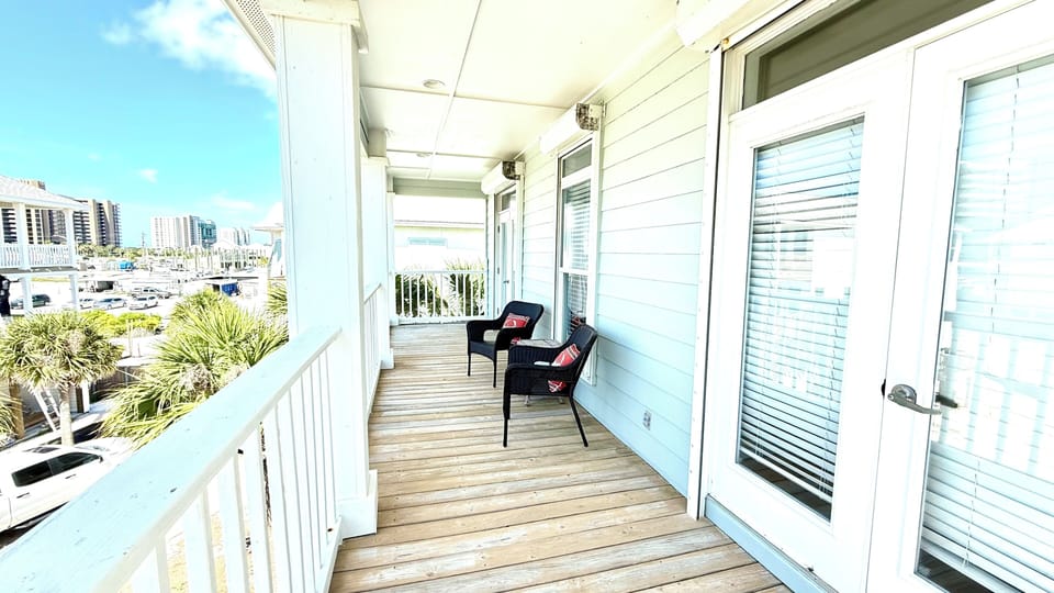 Upper front porch with access from two upstairs bedrooms
