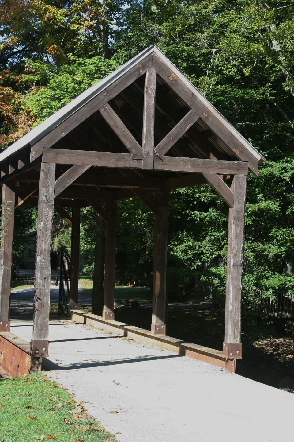 The gated covered bridge which leads to The Willow House