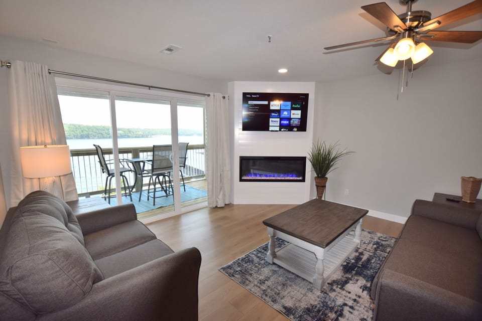 Modern furnishings with Shiplap and cozy modern fireplace that changes colors.