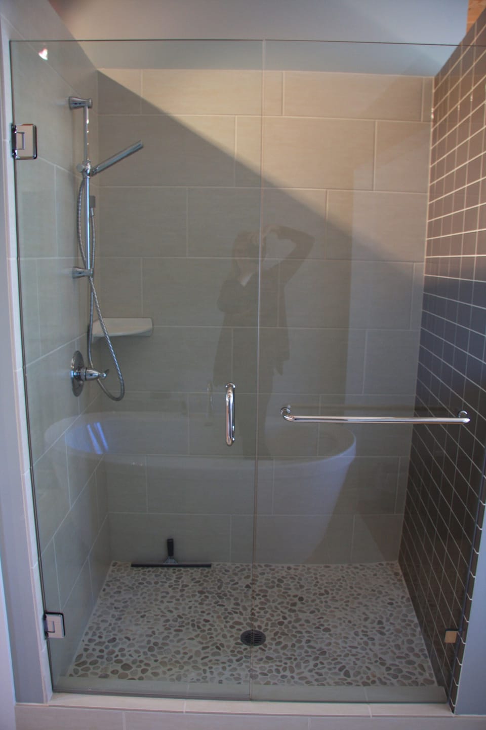 Pebble floor shower feels great on the feet.