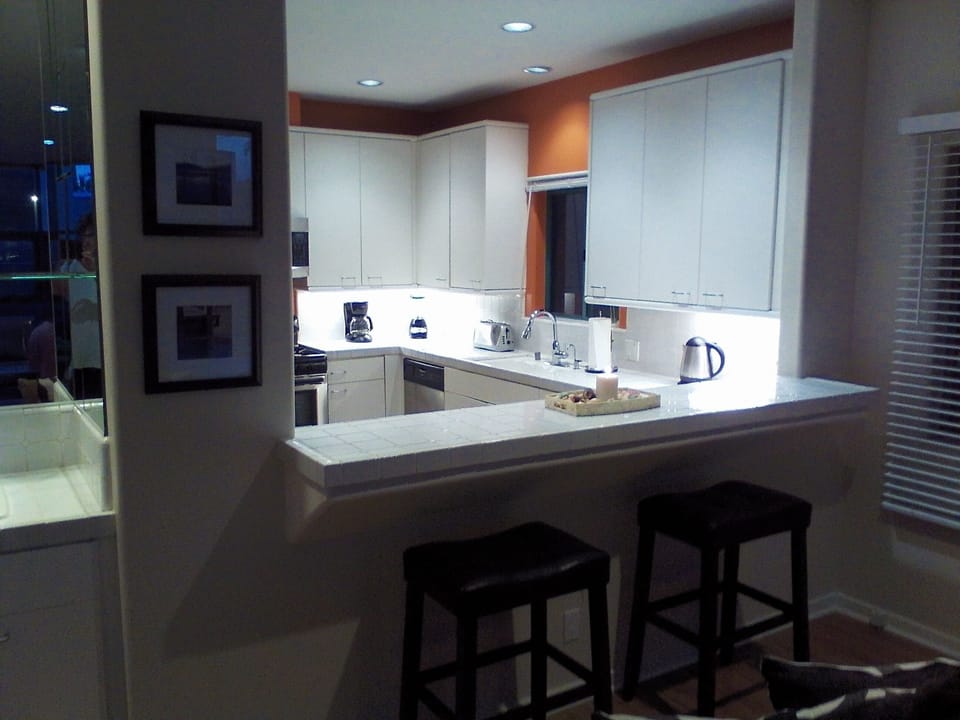 Another view of kitchen and bar stools.