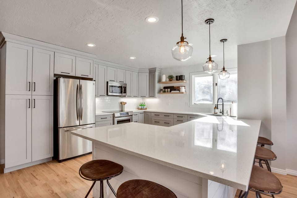 Clean line Kitchen, quartz counters, custom cabinets. Counter seating for 5