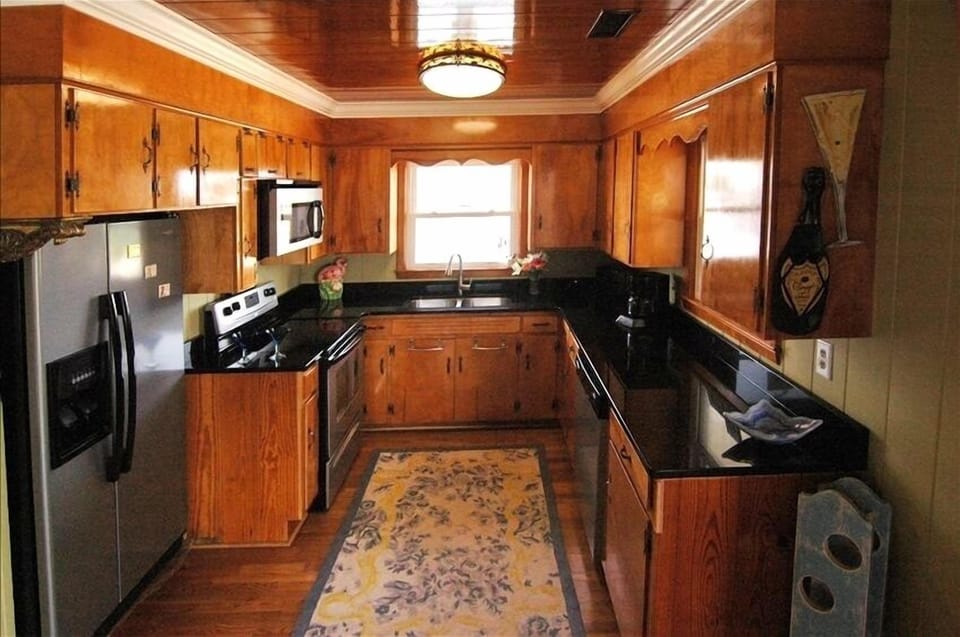 kitchen with granite countertop and all new appliances