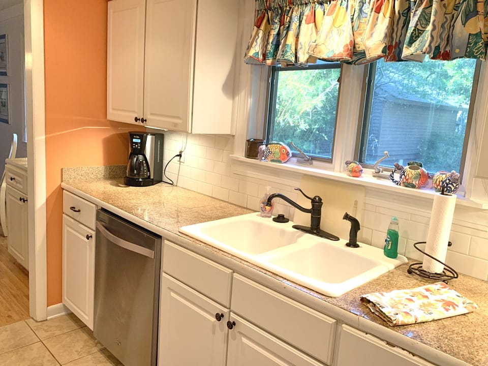 Kitchen overlooking Porch and Grill