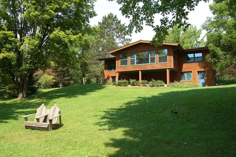 Back view of the lodge. All windows face lake.