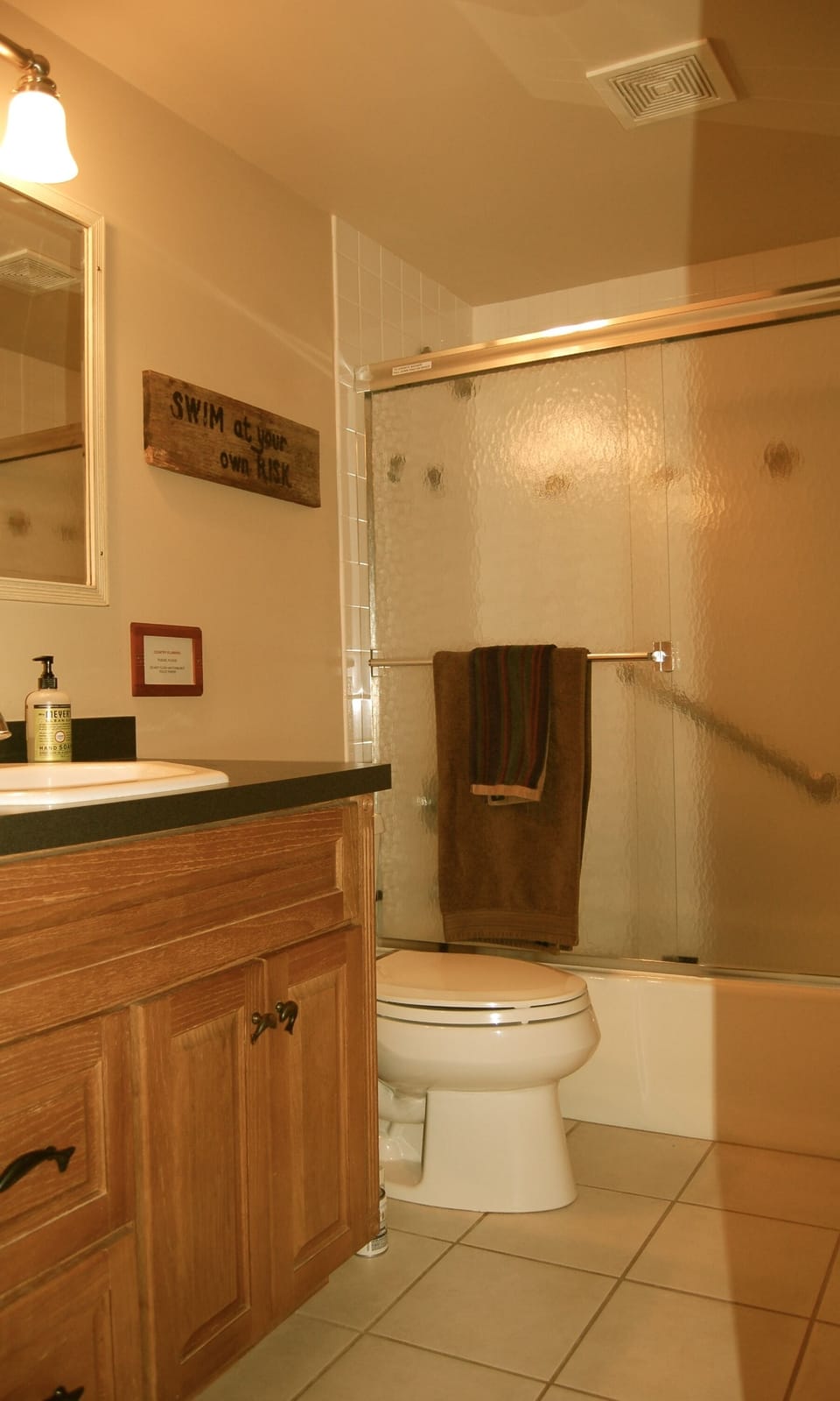Main floor full bathroom with tub and shower.