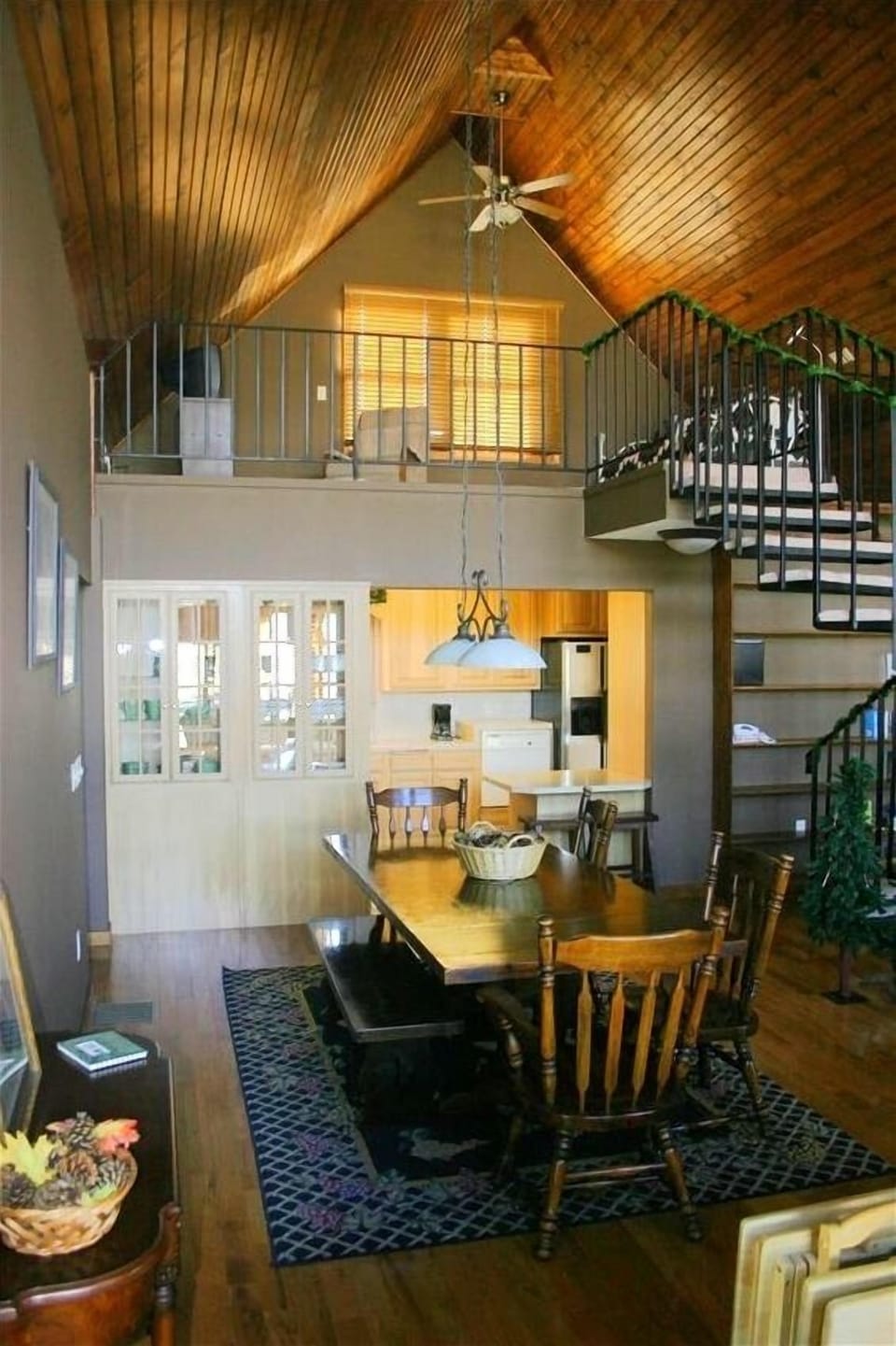 view from the living area to the loft and kitchen